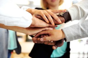 business people joining hands min