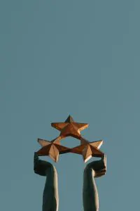 brown and black concrete building under blue sky during daytime